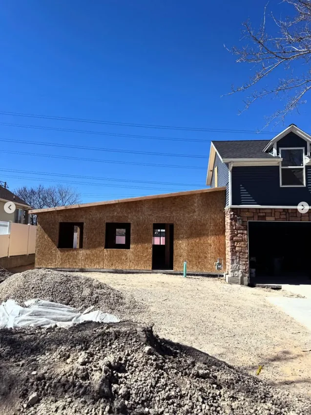Wide view of a house addition in progress by Frame Platinum LLC