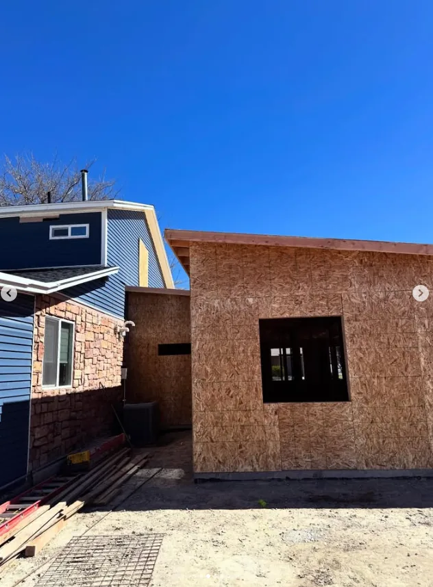 Side view of a framed addition under construction by Frame Platinum LLC