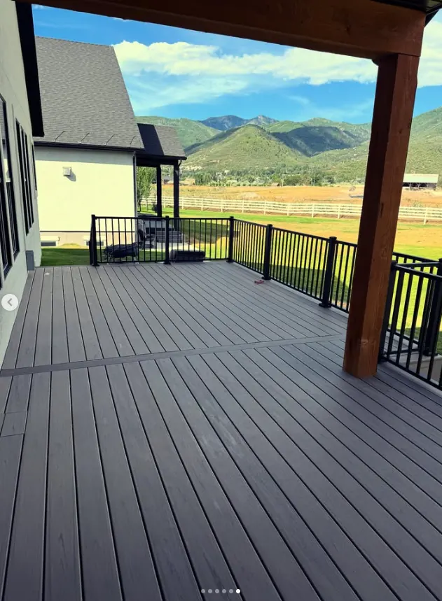 Covered deck overlooking the mountains by Frame Platinum LLC