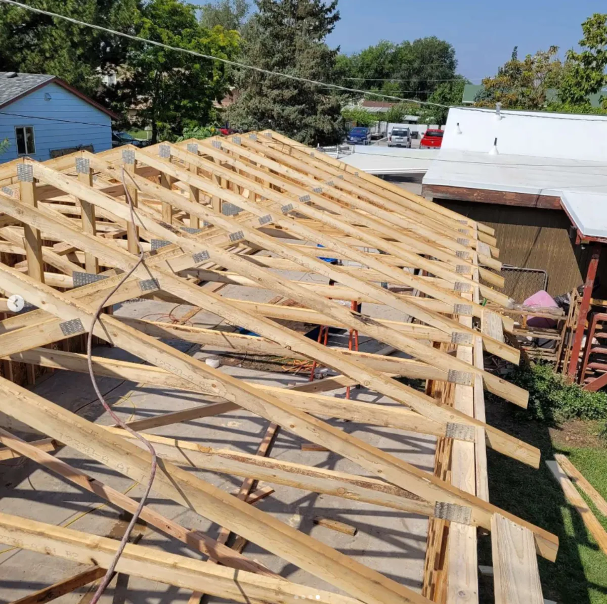 Roof trusses framed on a large structure by Frame Platinum LLC