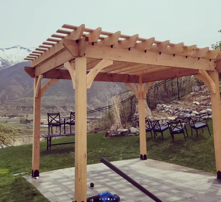 Pergola structure overlooking the mountains by Frame Platinum LLC