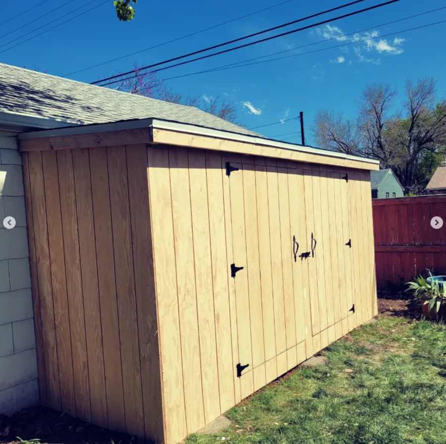Long side view of a custom shed by Frame Platinum LLC