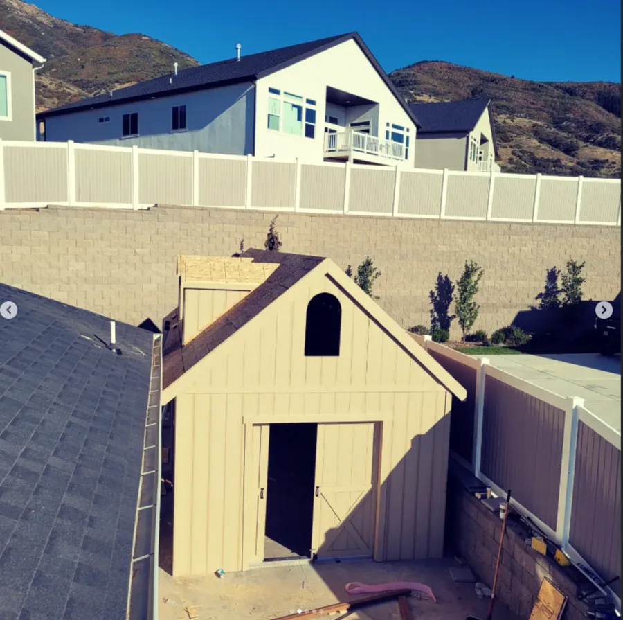 Custom shed with door open viewed from above by Frame Platinum LLC